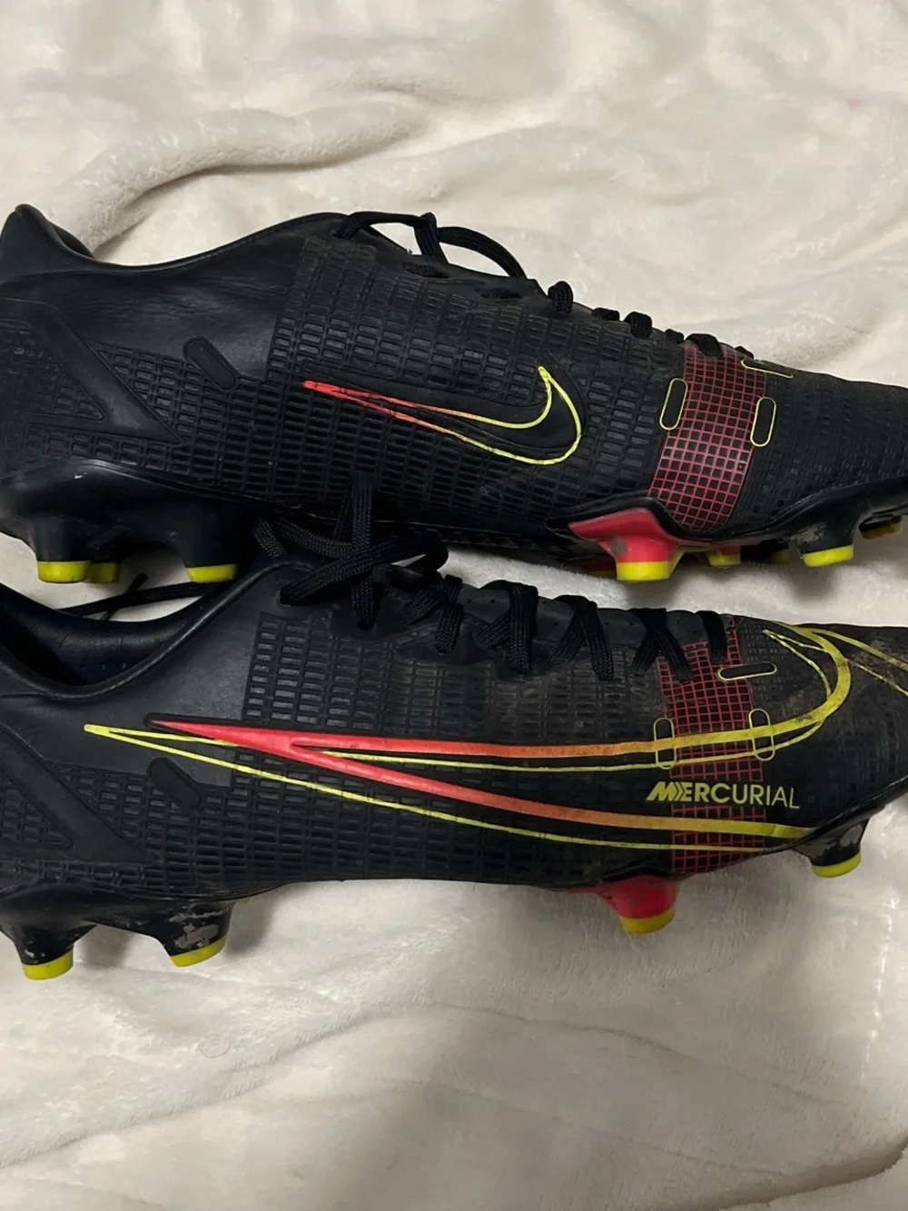 Nike Men's Black Soccer Cleats with Yellow and Red Accents